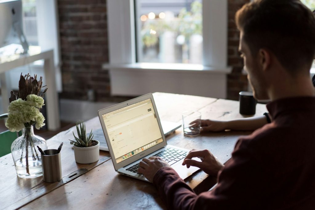 Person typing on laptop