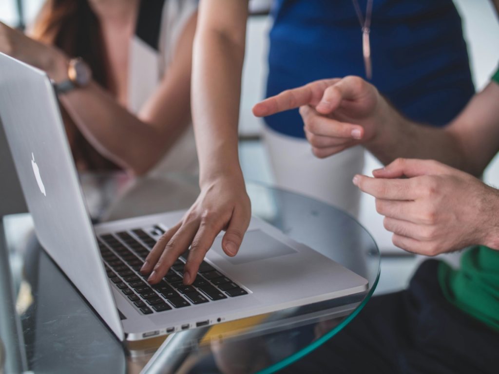 Group of people working on laptop